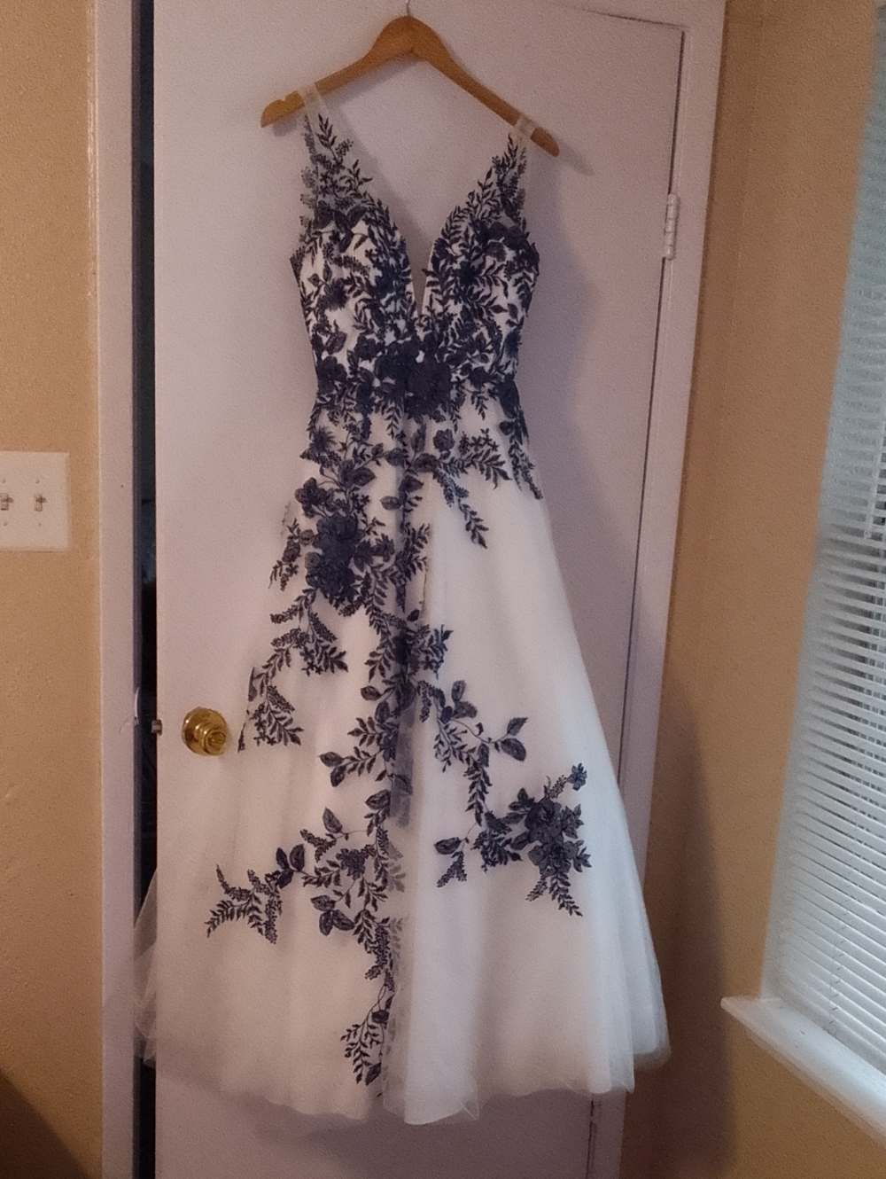 White Maxi Dress with Black Floral Appliqué - Elegant V-Neck